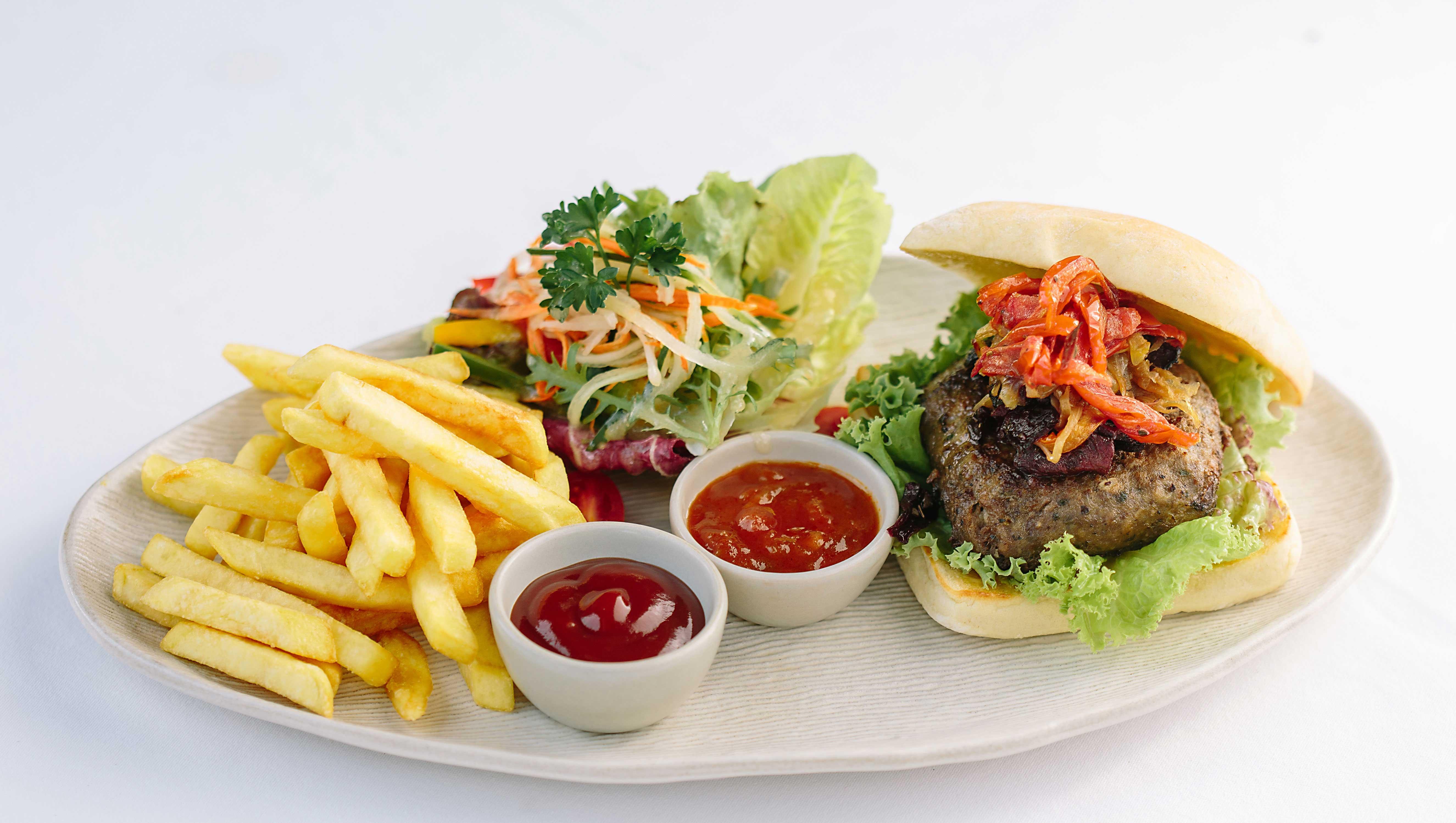 Tejaprana Resort & Spa Ubud  Exterior photo A hamburger with chips and salad